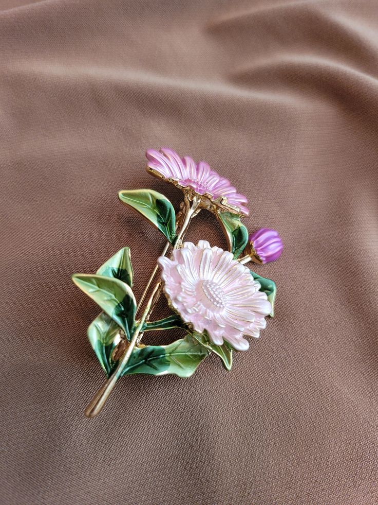 Pink and green enameled floral brooch.  Gold plated. Elegant Flower Enamel Pin Collectible, Elegant Enamel Flower Brooches, Formal Flower Enamel Brooches, Formal Flower-shaped Enamel Brooches, Formal Green Enamel Brooches, Elegant Pink Enamel Brooch Pin, Elegant Pink Enamel Pin, Elegant Green Enamel Pin, Flower Shaped Enamel Pin For Gift