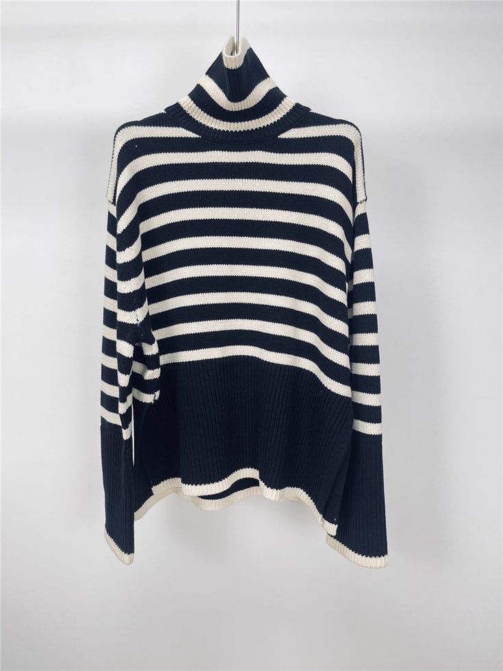 Features: This loose striped turtle neck sweater is the perfect combination of fashion and comfort. The elegant design and warm knit material make it a great option for casual wear. With its relaxed fit and stylish stripes, this sweater is a must-have for any fashion-forward woman. Stay warm and stylish this season with this high-quality pullover. Chic Sweater With Contrast Stripes For Winter, White Striped Hem Sweater For Fall, Chic Fall Sweater With Striped Collar, Oversized Striped Sweater For Fall, Striped Long Sleeve Casual Turtleneck, Trendy Horizontal Stripe Sweater For Winter, Black Sweater With Striped Collar, Winter Sweater With Striped Hem And Long Sleeves, Trendy Horizontal Stripe Winter Sweater