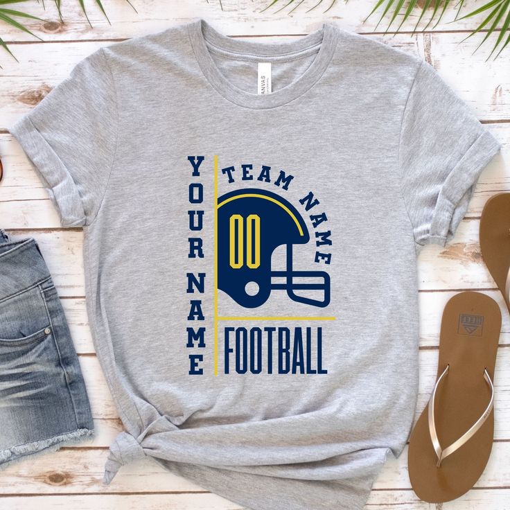 "Cheer on your favorite team in style with our Custom Football Shirt! 🏈⚽ Show your love for the game with a personalized touch - your name on the back makes it uniquely yours. The perfect gift for football moms and dedicated fans. Elevate your game day fashion with this must-have piece. ⚡ #CustomFootball #PersonalizedSportsStyle #GameDayFashion" ✨ K E Y * D E T A I L S ✨ Colors may vary slightly due to fabric and screen differences. 🌈 Premium DTF Printing for vivid graphics. ⚡️ Ships in just 1 Collegiate T-shirt With Name Print For Fans, Customizable Crew Neck T-shirt For Fan Gear, Customizable T-shirt For Football Season, Customizable Cotton Sports T-shirt, Team-colored T-shirt With Team Logo, Team Color T-shirt For Fan Gear, Team Spirit T-shirt With Letter Print For Fans, Team Spirit T-shirt With Team Logo For Football Season, Team Spirit T-shirt With Team Logo For Sports Season