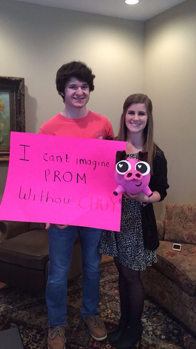 two people holding up a sign that says i can't imagine prom without choir