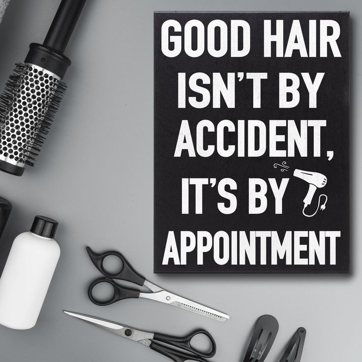 a sign that says good hair isn't by accident, it's by appointment