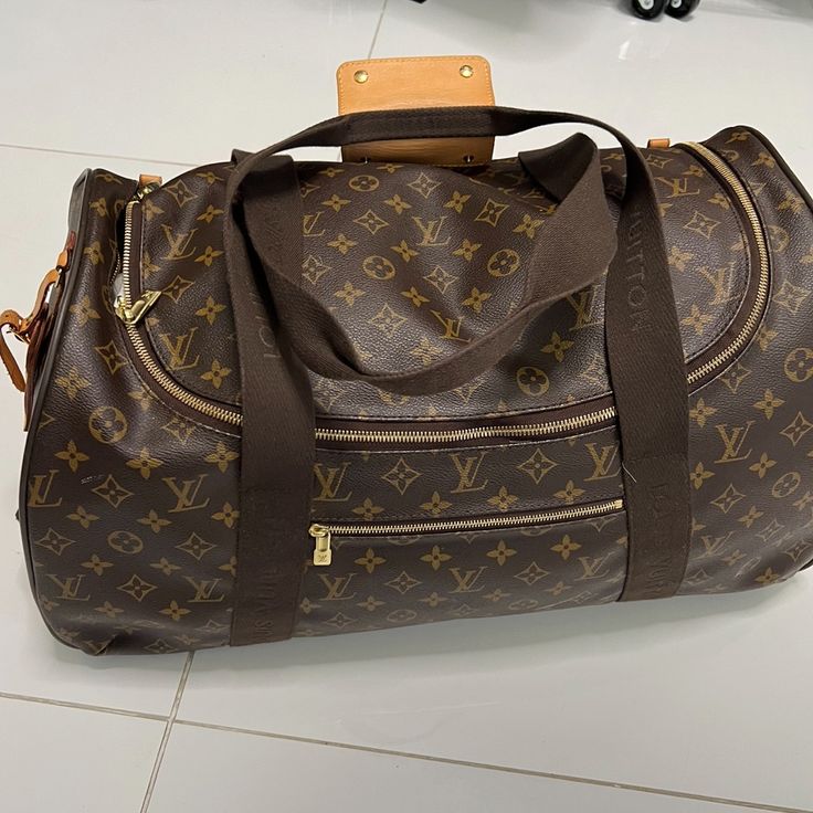 Authentic Louis Vuitton Brown Monogram Neo Eole Monogram Canvas 55 Weekender Bag Rolling Luggage Louis Vuitton Weekender Bag From The 2016 Collection By Nicolas Ghesquire Brown Coated Canvas Lv Monogram Made In France Brass Hardware Leather Trim Flat Handles & Single Adjustable Shoulder Strap Leather Trim Embellishment & Single Exterior Pocket Nylon Lining & Single Interior Pocket Zip Closure At Top Protective Feet At Base Shoulder Strap Drop: 2 Louis Vuitton Weekender, Louis Vuitton Brown, Lv Monogram, Brown Coat, Brass Hardware, Weekender Bag, Monogram Canvas, Leather Trim, Authentic Louis Vuitton