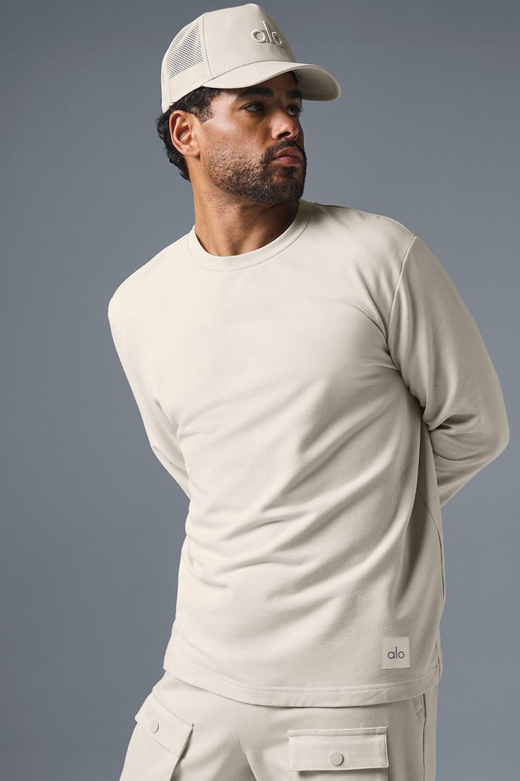 Thick and substantial with just-right drape, think of the Double Take as a leveled-up version of your favorite long sleeve. The fit is a touch oversized (in a cool way, not a slouchy way) with slightly extended sleeves, ribbed cuffs and a slightly extended hem. Wear it with baggy cargos, casual shorts or any time you want to look put-together with minimal effort. Long Sleeve Alo Yoga Tops For Fall, Alo Yoga Long Sleeve Tops For Fall, Alo Yoga Oversized Sweatshirt For Fall, Alo Yoga Long Sleeve Winter Top, Alo Yoga Long Sleeve Top For Winter, Snug Long Sleeve Tops With Ribbed Cuffs, Alo Yoga Fall Loungewear Tops, Alo Yoga Long Sleeve Fall Sweater, Alo Yoga Relaxed Fit Tops For Fall