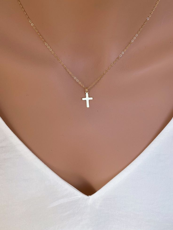 Dainty 14k Gold fill Cross Necklace Woman. Super cute small cross necklace is great gift for her Christmas, This necklace is made of.... -14k gold fill 15mm cross pendent, and -14k gold fill cable chain with spring clasp, -Come up with beautiful ribbon gift box and -One set of Care instruction package. MORE CROSS JEWELRY https://www.etsy.com/shop/rainbowearring?search_query=CROSS MORE LAYERED NECKLACES https://www.etsy.com/shop/rainbowearring1?section_id=17891444&ref=shopsection_leftnav_5 CO Minimalist Crucifix Jewelry With Delicate Chain, Minimalist Cross Charm Necklace With Delicate Chain, Simple Cross Jewelry With Delicate Chain, Dainty 14k Gold Cross Necklace With Delicate Chain, Dainty 14k Gold Cross Necklace, Simple Yellow Gold Cross Necklace, Minimalist Cross Pendant Charm Necklace, Dainty 14k Gold Cross Pendant Charm Necklace, Simple Cross Clavicle Chain Jewelry