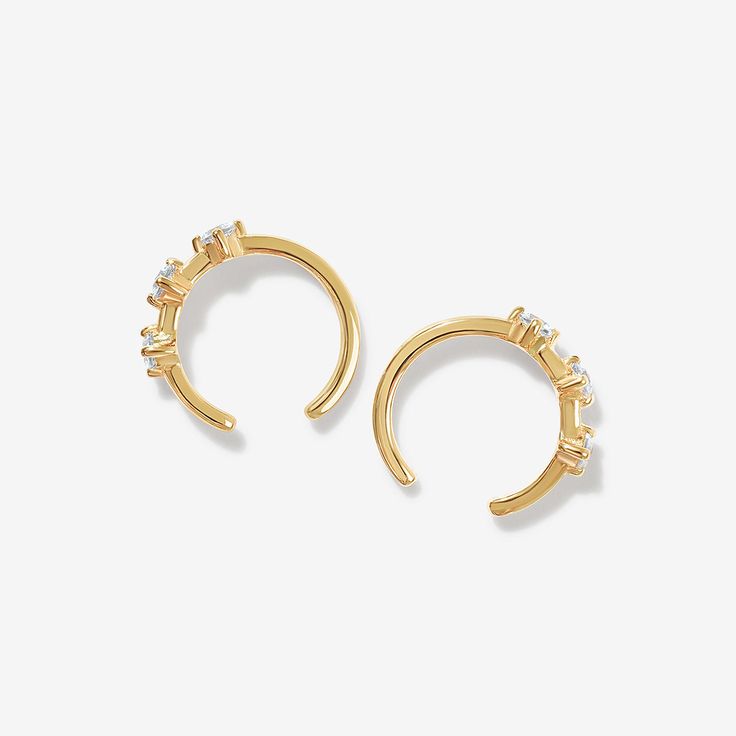 Stay elegant in these ear cuffs. Lazio's sleek design, with triple round cut crystal detailing, makes them the type of earrings to be remembered. Created with a sterling silver base and utilizing luxury 14 karat gold plating, these Adorn Luxe earrings are everything you love about our collection, but with a ‘demi-fine’ jewelry finish. Modern Gold Earrings With Sparkling Stones, Modern Open Ring Earrings For Pierced Ears, Gold Cubic Zirconia Ear Climbers Fine Jewelry, Elegant Sterling Silver Small Hoop Ear Cuff, Elegant Small Hoop Sterling Silver Ear Cuff, Elegant Pierced Small Hoop Ear Cuff, Elegant Small Hoop Pierced Ear Cuff, Elegant Hoop Style Pierced Ear Cuff, Elegant Pierced Hoop Ear Cuff