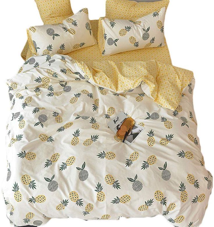 a bed with pineapples and polka dots on it