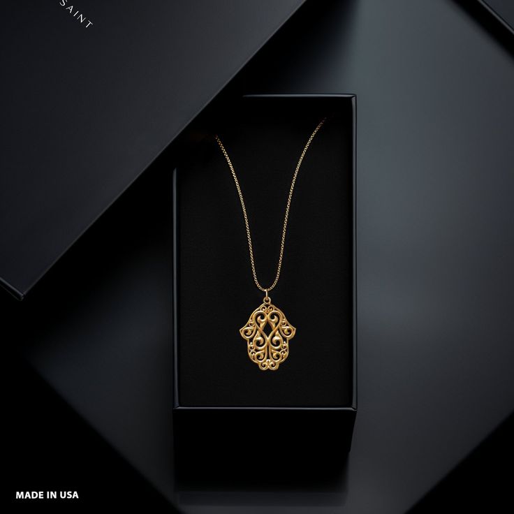 Elevate your style with our gold Hamsa hand pendant. This solid gold necklace showcases exquisite craftsmanship, symbolizing protection and blessings. The 14 karat gold Hamsa Hand pendant is more than just jewelry; it's a fine representation of symbolism and cultural significance, also available in 18k yellow gold. PENDANT INFORMATIONThis pendant is made of real, solid gold.• Made in USA• Material: 14k or 18k solid gold• Finish: polished• Height: 1.25" (32 mm) x Width: 1" (24,5 mm)• Pendant weig Hand Pendant, Gold Hamsa, Hamsa Pendant, Solid Gold Necklace, Solid Gold Chains, Floral Pendant, With Meaning, Patron Saints, Hamsa Hand