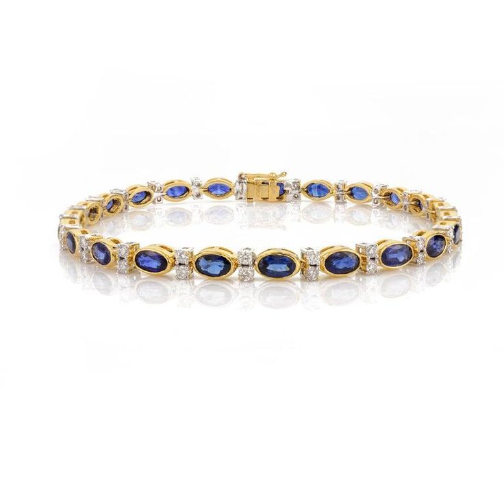 This is part of Chairish’s Fine Jewelry assortment.  This 6.91 CTW Natural Blue Sapphire Diamond Wedding Tennis Bracelet in 18K gold showcases endlessly sparkling natural blue sapphire of 6.91 carats and 0.97 carats diamonds. It measures 7.25 inches long in length.  Sapphire stimulates concentration and reduces stress.  Designed with perfect oval cut blue sapphire set with a diamond to make you stand out on any occasion or event. The elegant style complements the attire beautifully and is a perf Blue Diamond Bracelet With Brilliant Cut Luxury Style, Luxury Sapphire Tennis Bracelet With Diamond Accents, Luxury Blue Diamond Bracelet With Brilliant Cut, Luxury Blue Diamond Bracelet With Accents, Luxury Blue Oval Diamond Bracelet, Luxury Blue Diamond Bracelet For Anniversary, Luxury Blue Diamond Bracelet For Formal Occasions, Luxury Blue Diamond Bracelet For Formal Events, Luxury Blue Diamond Anniversary Bracelet