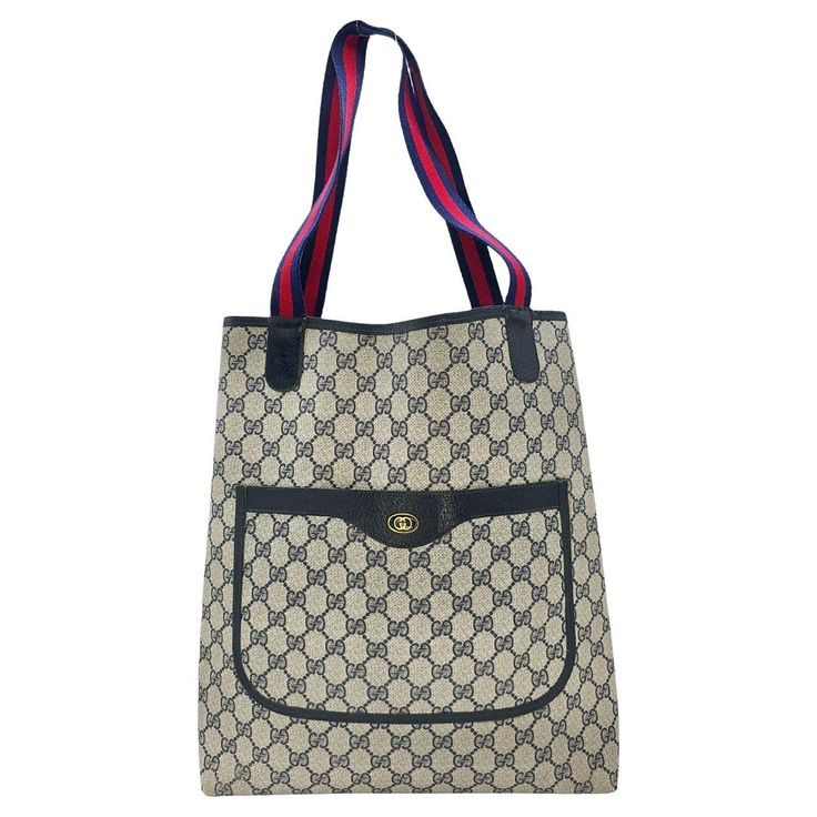 As stylish as it is spacious, this Gucci Vintage GG Monogram Sherry Tote is the perfect accessory for your everyday needs. Featuring the iconic GG Monogram coated canvas with leather trimming and gold-tone interlocking G logo, it offers a chic and versatile look. With a roomy navy interior and sturdy web fabric shoulder straps, this tote is in very good condition and is sure to elevate your style. Made in Italy, it's a true testament to Gucci's quality and craftsmanship. Designer: Gucci Material: GG Plus, Web Accent, Leather Trim Date/Authenticity Code: 904-02-003 Measurements: 12"W x 14"H x 5"D Strap Drop: 9.5" Interior Lining: Canvas Opening/Closure: Open Hardware: Gold-tone Includes: Entrupy COA Overall Condition: Very good pre-owned vintage condition with some minor residue to the inte Navy Interior, Tote Outfit, Gucci Vintage, Gg Monogram, G Logo, Bags Logo, Hardware Gold, Vintage Coat, Leather Trim