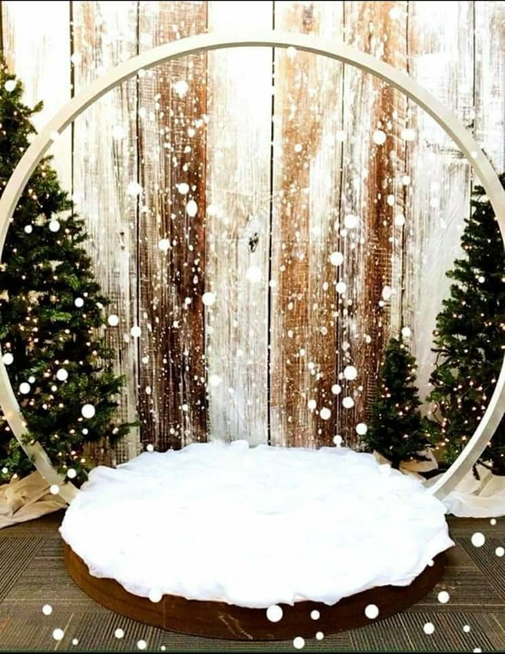 a snow globe in front of a wooden wall with christmas trees and lights around it