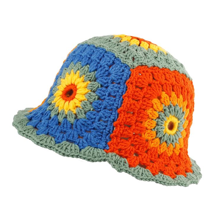 a crocheted hat with an orange, blue and yellow flower on the brim