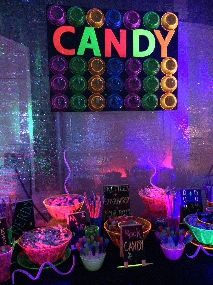 a candy bar with neon lights and candies