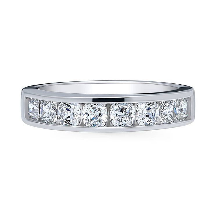 a white gold wedding band with five princess cut diamonds on the side and channel set in between