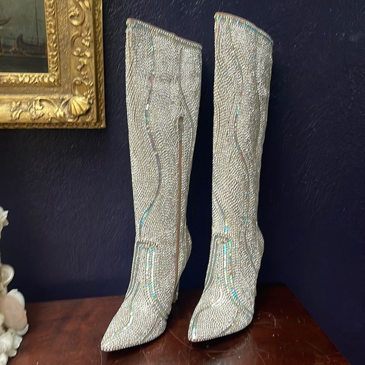 A Pair Of Fabulous Diamond/ Rhinestone Stiletto Boots. They Are Knee Hight With A Inside Zipper. The Boots Are Beautiful And Festive. They Have Never Been Worn And Are Size 9. They Have Their Original Box. Luxury Rhinestone Boots For Formal Occasions, Elegant Embellished Boots For Night Out, High Heel Rhinestone Boots For Cocktail, Cocktail Boots With Rhinestones And Pointed Toe, Cocktail High Heel Boots With Rhinestones, Elegant Rhinestone Boots With Round Toe, Elegant Fitted Boots With Bling Details, Elegant Evening Boots With Rhinestones, Elegant Fitted Boots With Bling