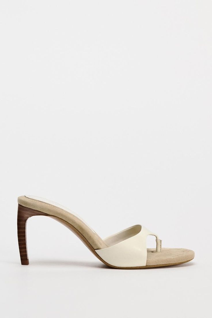 HEELED LEATHER SLIDES - Off White | ZARA United States Elegant Square Toe Mules With Wooden Heel, Modern High Heel Mules With Heel Loop, Classic Open Heel Mules With Padded Heel, Classic Mules With Padded Open Heel, Classic Mules With Single Toe Strap, Cream Leather Sandals With Wooden Heel, Beige Open Toe Mules With Padded Heel, Leather High Heel Mules With Padded Heel, Spring Wooden Heel Mules With Square Toe