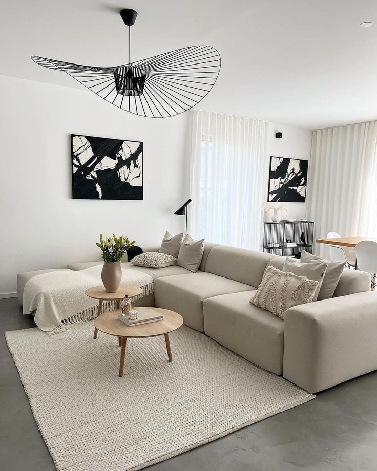 a living room filled with furniture and white walls