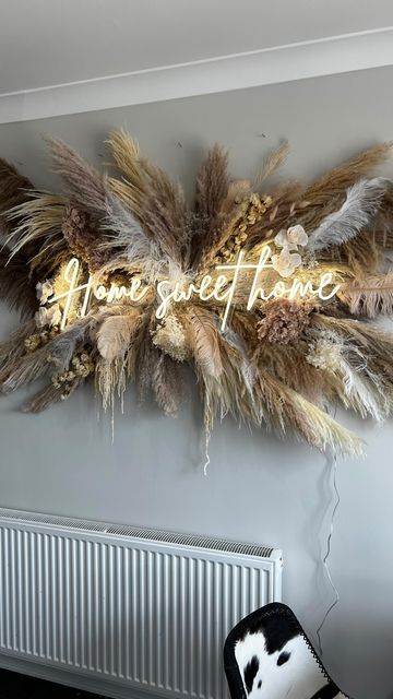 there is a wall decoration with feathers on it