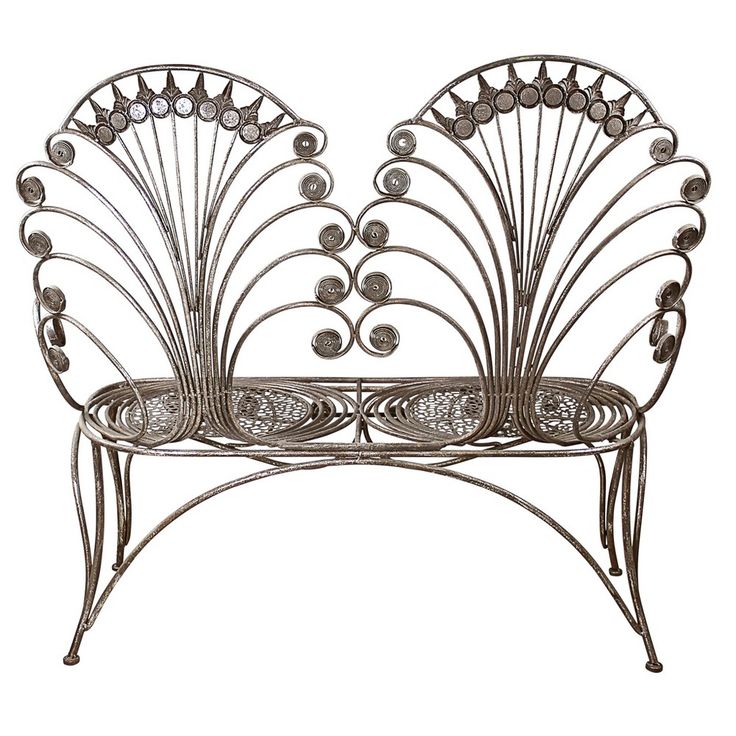 a metal bench with intricate designs on it's back and sides, isolated against a white background