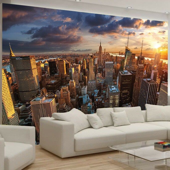 a living room filled with furniture and a large wall mural on the side of it