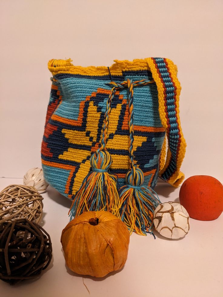 Colorful Handmade Colombian Medium Mochila Made in crochet by Colombian Wayuu indigenous. Perfect as a gift on any occasion. Approximate Size: Length: 10.25, width: 9.20, and cord: 54 Inches. Hand wash cold, do not tumble dry. Made in Colombia. Shoulder Bags, Hand Wash, Shoulder Bag, Crochet, 10 Things, Gifts, Color