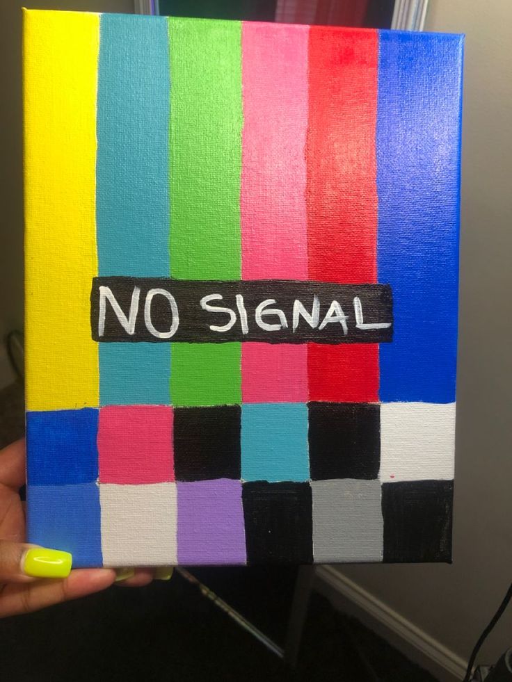 someone is holding up a piece of art that has been painted with different colors and the words no signal written on it