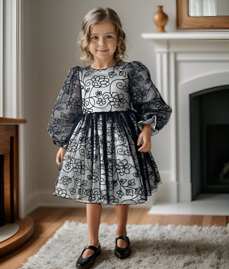 ✿ABOUT THIS DRESS ✓Our handmade dress is perfect for special occasions such as recitals, pageants, and official invitations.  ✓The elegant white satin bodice is adorned with delicate black floral embroidery, adding a touch of sophistication to the dress. ✓The long-sleeved is made of fluffy tulle, creating a dreamy and romantic look. ✓The dress is lined with 100% cotton, ensuring your little one stays comfortable throughout the event.  ✿FABRIC INFORMATION ✓Natural cotton lining 100% under the ski Elegant A-line Pageant Dress, Elegant Fitted Dress For Pageant, Elegant Fitted Pageant Dresses, Elegant Dresses For Holiday Pageants, Elegant Holiday Dress-up Dresses, Fitted Dress For Spring Pageant, Fitted Spring Dress For Pageants, Elegant A-line Dresses For Pageant, Spring Satin Dress For Dress-up Occasions