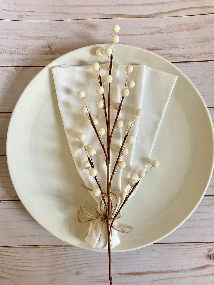 a white plate with some flowers on it