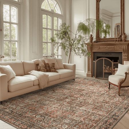 a living room filled with furniture and a fire place in front of a large window