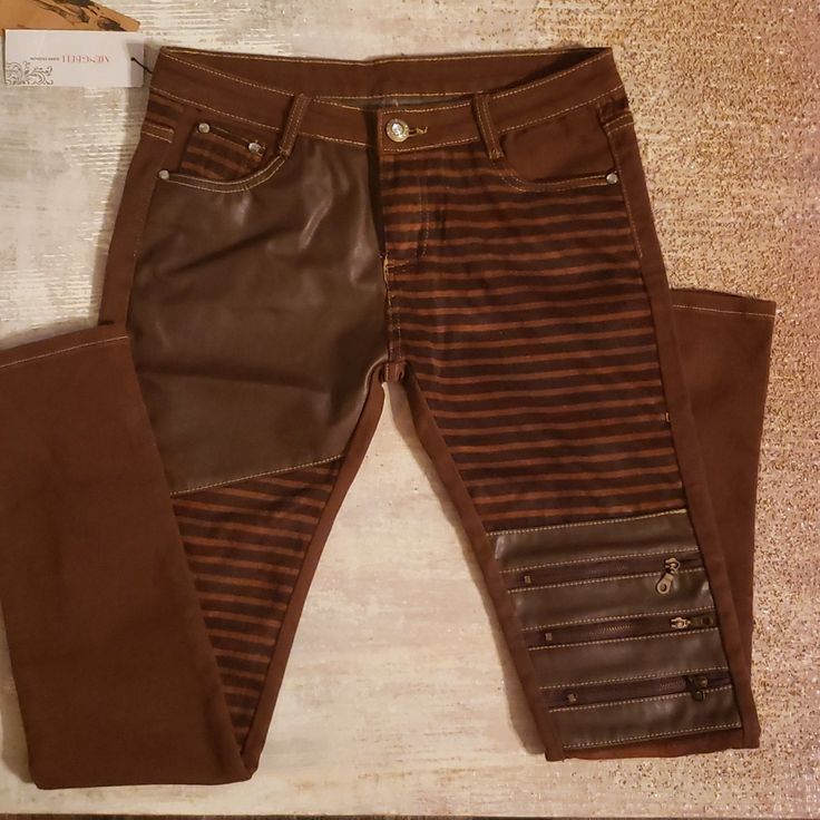 These Are The Coolest Jeans/Pants. There Is A Mixture Of Materials Leather/Suede, Zippers On Left Knee And Rhinestones For Closure Button And Rhinestone Accents On Back Pockets. I Have My Own Pair And I Always Get The Most Compliments. Brown Bottoms With Zipper Closure For Spring, Trendy Brown Bottoms With Zipper Closure, Trendy Faux Leather Jeans For Fall, Trendy Fitted Faux Leather Jeans, Edgy Fitted Brown Bottoms, Edgy Brown Fitted Bottoms, Edgy Brown Bottoms For Fall, Leather Bottoms With Side Zipper For Fall, Casual Brown Leather Jeans