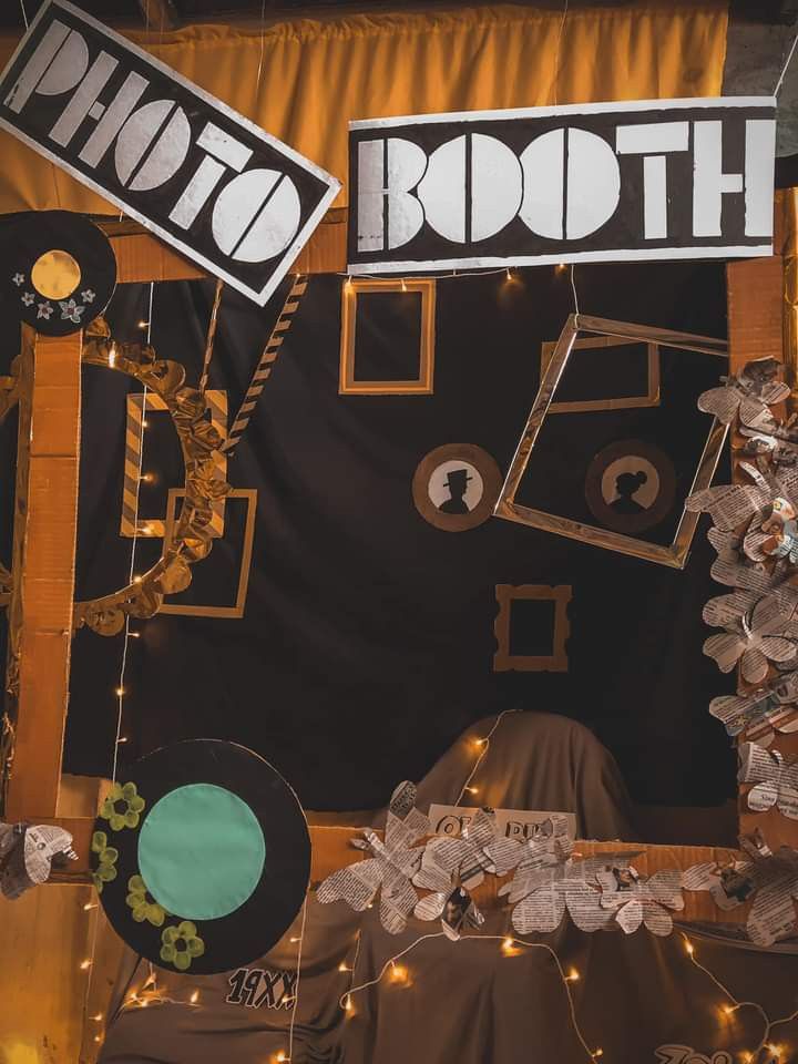 a photo booth set up with lights and decorations