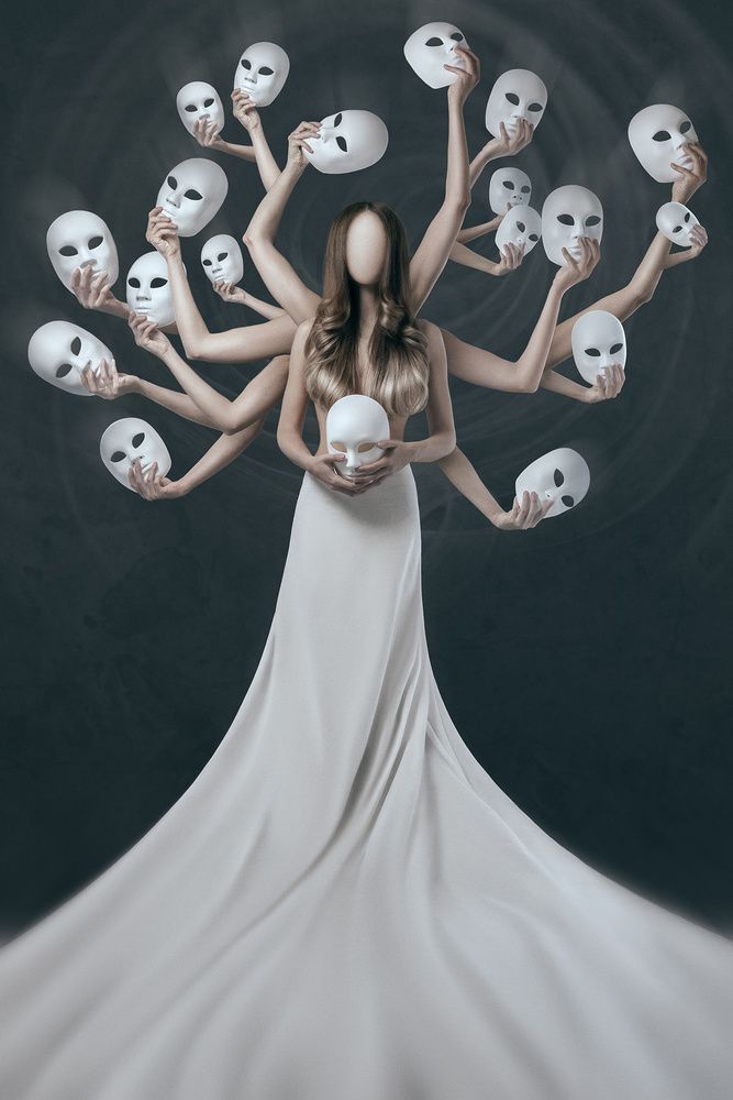 a woman in a white dress surrounded by skulls holding up her hands and looking at the camera