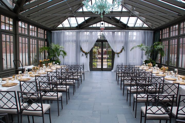 an indoor dining area with tables and chairs set up for a formal dinner or party