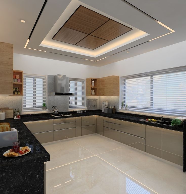 a modern kitchen with black counter tops and white walls, along with wooden blinds on the windows