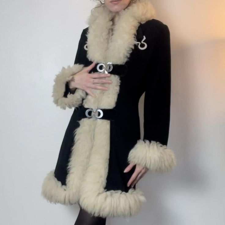 Experience timeless elegance with our Women Penny Lane Coat, a chic black shearling coat that combines vintage charm with modern style. This long fur coat features genuine wool construction and a cozy shearling lining, ensuring warmth and comfort. Inspired by 70s boho hippie fashion, this Afghan coat boasts a retro aesthetic perfect for any fashion-forward wardrobe. The luxurious fur trim adds a touch of sophistication, while the versatile design makes it a standout piece for any occasion. Embra Boho Hippie Aesthetic, Black Shearling Coat, Hippie Mode, Afghan Coat, Long Fur Coat, Penny Lane Coat, Hippie Fashion, Coat Fur, 70s Boho