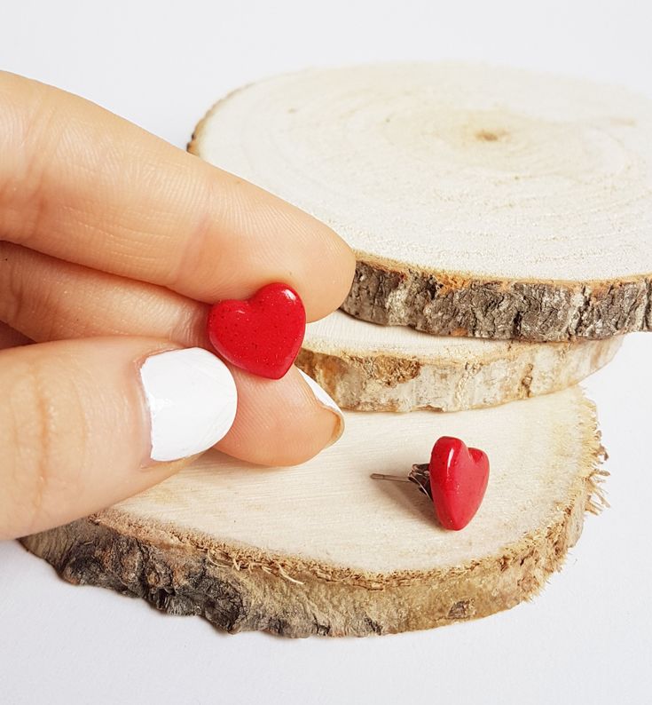 This shimmering Red Heart Stud Earrings will definitely steal anyone's heart! ;) If you are looking for the right gift for a special someone, then you've came to the right place! * Handmade Red Heart Stud Earrings * Made from Shimmering Polymer Clay * Width: 0.5 inches (1.2 cm) * Earring posts: Stainless steel * Earrings are light and easy to wear * Earrings arrive nicely packed in a eco friendly box You can also add gift wrapping and a gift message to your jewelry. The gift wrapping includes ec Handmade Heart Earrings For Valentine's Day Gift, Red Heart Print Earrings For Gifts, Cute Nickel-free Heart Earrings For Valentine's Day, Red Heart Beads Earrings For Gift, Heart-shaped Earrings With Heart Beads For Gift, Handmade Heart Cut Earrings For Valentine's Day, Cute Red Heart Earrings For Pierced Ears, Valentine's Day Heart Earrings For Jewelry Making, Valentine's Day Heart-shaped Earrings