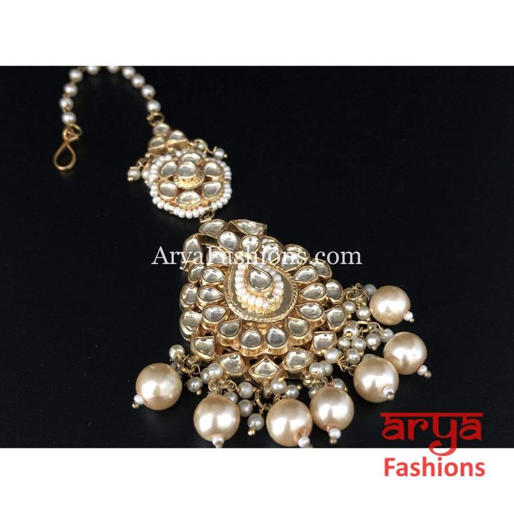 Bridal Kundan Mang Tika with Pearl Beads. Features: Mang Tika: Approx. 5 Inches Hook feature to tie the mang tika to hair Made in Brass with golden finish and high quality Kundan stones Lightweight Jewelry Suitable for any occasion and traditional or Modern attire Ready to ship and available for local pickup from 23059. Please message us for more details Free shipping on orders above $75 within USA. Traditional Adjustable Kundan Necklace With Stone Work, Adjustable Gold Kundan Necklace With Latkans, Traditional Adjustable Kundan Necklace With Tilla, Adjustable Traditional Kundan Necklace With Stone Work, Adjustable Kundan Necklace With Tilla For Festivals, Adjustable Temple Jewelry Tikka With Stone Work, Traditional Adjustable Meenakari Tikka, Traditional Meenakari Tikka With Adjustable Fit, Traditional Meenakari Tikka Adjustable