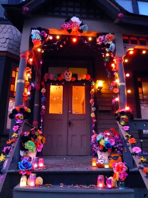 a house decorated with halloween decorations and lights