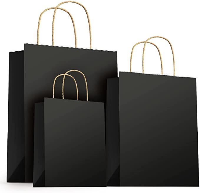 three black shopping bags with gold handles