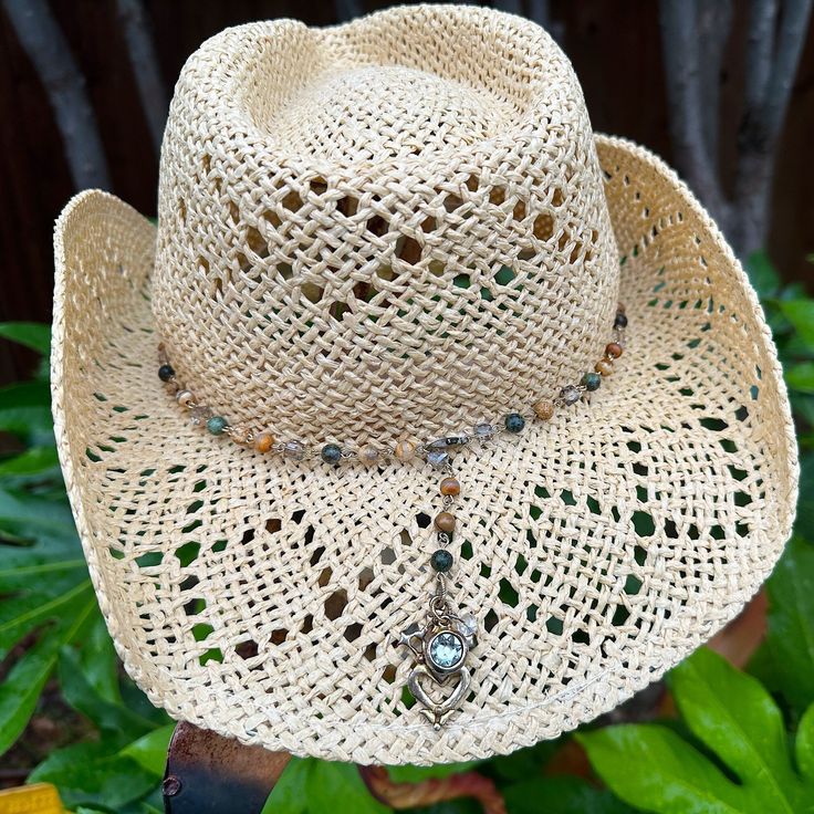 "The Skye hatband is hand crafted from a crystal rosary chain beaded with African Turquoise, Picture Jasper, and Agate.  She is finished with a 12k Antiqued Gold Luckenbooth Charm, a round Black Diamond Swarovski crystal set in Antiqued Gold, and a tiny crystal drop bead.  The Luckenbooth is a Scottish love token which is also worn for protection from the evil eye.  For a simpler hatband, please choose \"no charms\". The Skye hatband is fully adjustable and can be clasped at any length making her perfect for any hat or sling her around your neck for a super cute y-style or lariat necklace.  Full length of the chain is 26 inches.  If you would like a different length, please put that in the notes and I will adjust accordingly!  Your hatband will be shipped ready to gift in a gift box or to Crystal Rosary, Flat Brim Hat, Festival Hat, Unique Hats, Love Token, African Turquoise, Rosary Chain, Western Hats, Western Boho