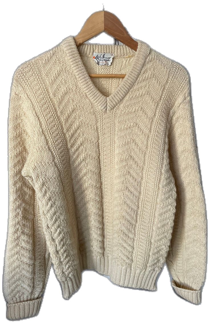 Classic Cream V-neck Sweater For Winter, Classic Wool Sweater With Textured Knit, Classic V-neck Textured Knit Sweater, Classic Cream V-neck Sweater For Fall, Classic Beige Wool V-neck Sweater, Classic Long Sleeve Cream Sweater, Classic Cream Polo Sweater, Classic Cream V-neck Long Sleeve Sweater, Classic Knitted V-neck Sweater For Fall