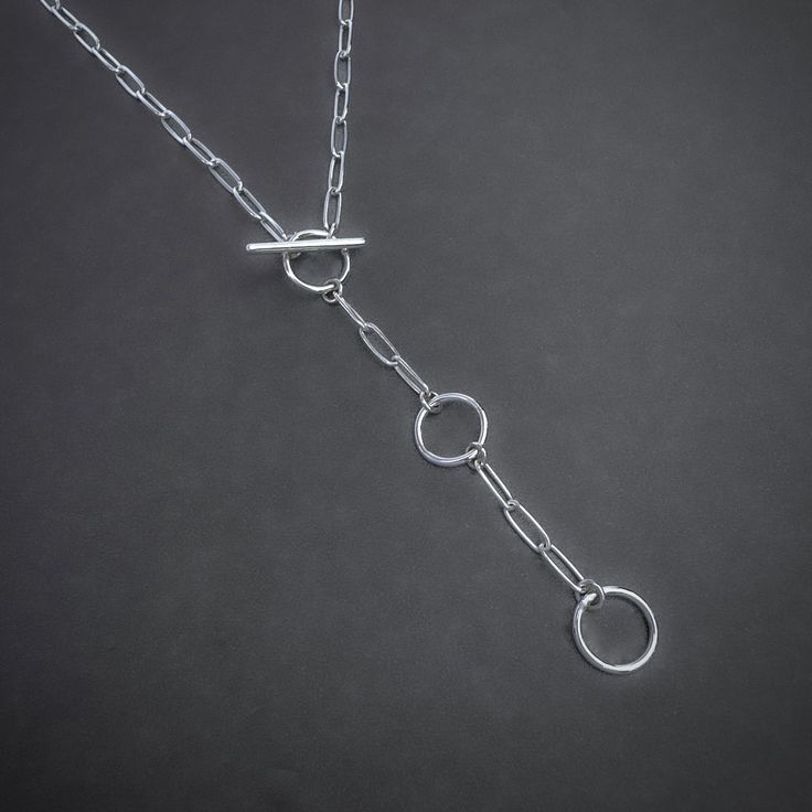 Elevate your everyday look with this handcrafted Paperclip Chain Toggle Necklace. The unique toggle clasp adds a touch of modern charm, while the adjustable length allows for versatile styling options. Made from high-quality sterling silver, this necklace is the perfect addition to your jewelry collection. Details: Chain: Solid Sterling Silver Paperclip Chain, 3mm Clasp: Handcrafted Sterling Silver toggle clasp, adjustable length Sizes: 16 inches to 24 inches Shipping: Ready to ship within one b Gemstone Pendants, Toggle Necklace, Jewelry Gemstone, Lariat Necklace, Toggle Clasp, Pitcairn Islands, Guinea Bissau, Mozambique, Paper Clip