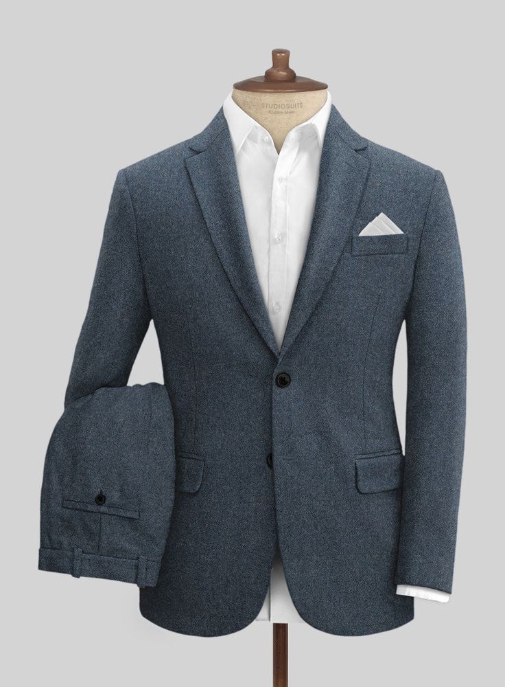 Opt for our Light Weight Bond Blue Tweed Suit and elevate your evening wear to a truly sophisticated style. Crafted from wool, tweed suits are appropriate for colder months as the material not only looks structured and professional but also keeps you warm.   Look Includes   Light Weight Bond Blue Tweed Fabric  Two Button Jacket Style  Notch Lapel  Horn Royal Black Buttons  Single Vent  Three Cuff Buttons  Two Welted Pocket on Trousers    Click 'Customize Now' to modify the look if needed.   Lini Elegant Fitted Tweed Sport Coat, Wool Suits With Herringbone Pattern For Business Casual, Tailored Wool Tweed Jacket With Welt Pockets, Tailored Wool Tweed Jacket For Business Casual, Elegant Tweed Suits For Winter, Business Fitted Tweed Blazer, Fitted Tweed Sport Coat For Semi-formal Occasions, Fall Semi-formal Tweed Jacket, Tailored Tweed Suits For Business Casual