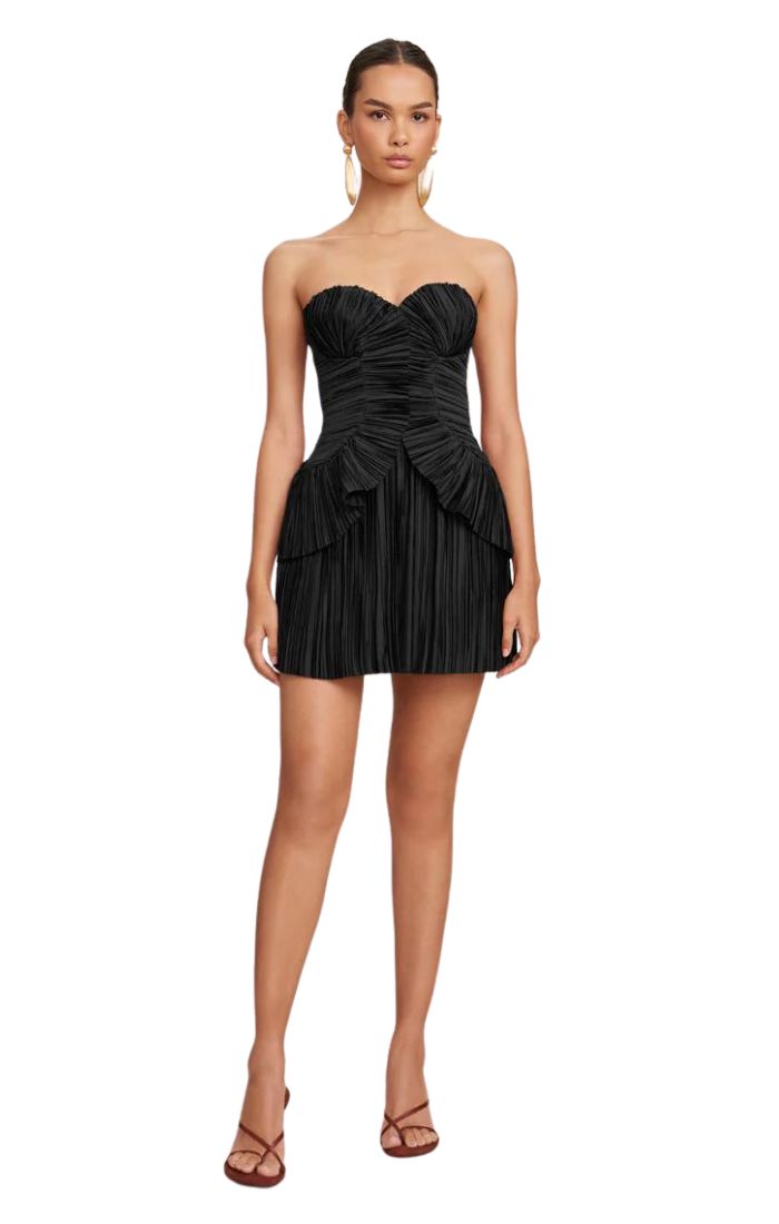 A pleated satin, strapless mini-dress with layered hip detail.- Inserted corset- Center back zipper- Fitted side paneling for a flattering silhouette Strapless Corset Dress With Ruched Bodice For Cocktail, Strapless Party Mini Dress With Pleated Bodice, Strapless Mini Dress With Pleated Bodice For Party, Strapless Cocktail Mini Dress With Ruched Bodice, Strapless Mini Dress With Ruched Bodice For Cocktail, Strapless Pleated Bodice Dress For Night Out, Strapless Satin Mini Dress With Ruffles, Strapless Corset Dress With Pleated Bodice For Evening, Strapless Ruched Mini Evening Dress