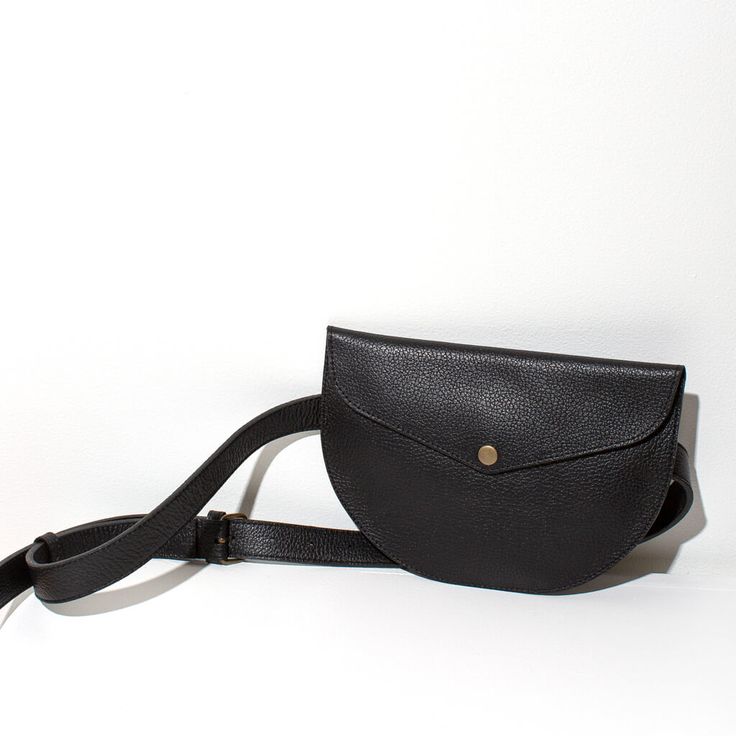 Add a stylish, functional touch to any outfit with our leather crossbody belt bag. Handmade by skilled artisans, this on-trend crossbody bag features an adjustable belt for a perfect fit. Perfect for travel or around-town. Wear around your waist, over the shoulder or cross-body. Soft yet structural leather. While our designs are modern, our approach is based in capturing the ancient. We collaborate with master craftspeople to create each piece. Size: 6 inches tall x 9 inches wide, flat profile B On-the-go Crossbody Shoulder Bag With Removable Belt, Chic Everyday Crossbody Belt Bag, Versatile Leather Crossbody Belt Bag, Versatile Soft Leather Crossbody Belt Bag, Versatile Soft Leather Belt Bag For Everyday, Chic Everyday Belt Bag With Adjustable Strap, Versatile Everyday Soft Leather Belt Bag, Classic Crossbody Belt Bag For Everyday, Versatile Everyday Crossbody Belt Bag