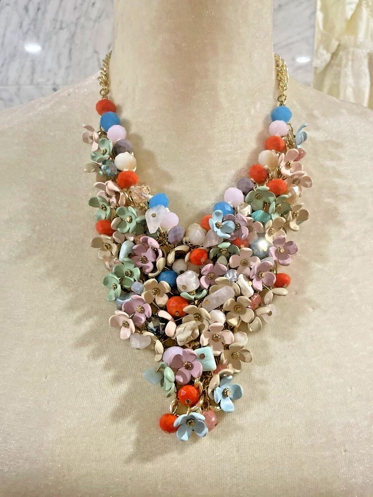 Elevate your style with this stunning statement necklace featuring a beautiful bubble design with vibrant colors of pink, coral, and green. The pendant shape is a flower and the main stone is a gorgeous glass flower that adds a touch of elegance to this piece.  Take me away on your vacay! The necklace is 16-20 inches long and has an excellent cut grade that makes the colors pop. This necklace is perfect for women who love vintage and antique jewelry. It is a great addition to any collection and can be worn for any occasion.  The necklace is NWOT and comes with a bid necklace. Get ready to turn heads with this unique and beautiful necklace. STATEMENT BID NECKLACE TTR Coral And Green, Bubble Design, Gorgeous Glass, Necklace Statement, Pink Coral, Bib Necklace, Beautiful Necklace, Flower Necklace, A Flower