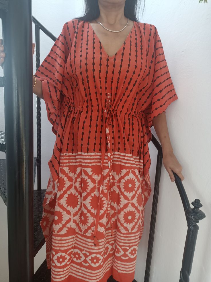 This Item is handmade. The fabric used is top quality cotton to ensure your skin is pampered and always natural. It is beautifully painted on with blocks- a traditional Indian style of printing.Each layered block by block,colour by colour, creating an exquisite design. The design is multi functional depending on your mood, Use it like a kaftan to lounge around the house in or even as a swim cover up for your day at the beach or pool. Washing Care: Hand wash for the first wash,Following which a g Bohemian Flowy Tunic With Batwing Sleeves, Red Bohemian Kaftan With Ikat Print, Red Bohemian Flowy Kaftan, Flowy Red Bohemian Kaftan, Bohemian Batik Print Kaftan For Vacation, Festival Patterned Kaftan With Kimono Sleeves, Patterned Kaftan With Kimono Sleeves For Festival, Bohemian Batik Print Kimono For Vacation, Red Bohemian Tunic Kimono