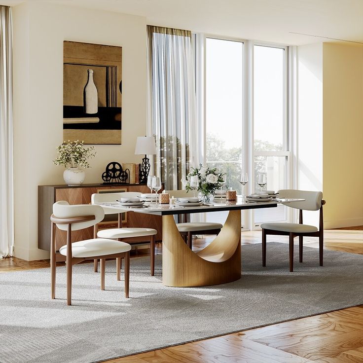 a dining room table with chairs and a vase on the wall in front of it