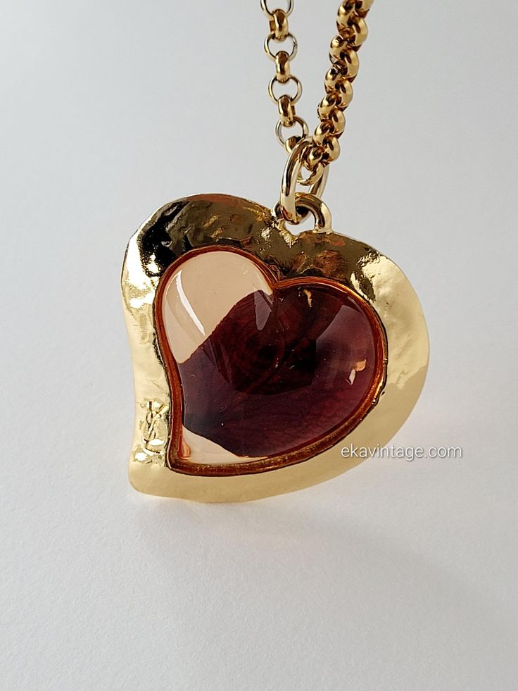 Authentic vintage Yves Saint Laurent Heart pendant with a rose petal inside. The chain provided with the pendant is not original. Created in the 1980s. Very good general condition. Signed "YSL". Dimensions: H - 5.0 cm, L - 4.0 cm. Free worldwide shipping with tracked parcel. Comes in a fabric pouch. Do not hesitate to contact me for any additional information (delivery method, request for additional photos, etc.). Yves Saint Laurent Necklace, Saint Laurent Vintage, Vintage Yves Saint Laurent, Fabric Pouch, Vintage Ysl, Vintage Heart, Mode Vintage, Rose Petals, Heart Pendant