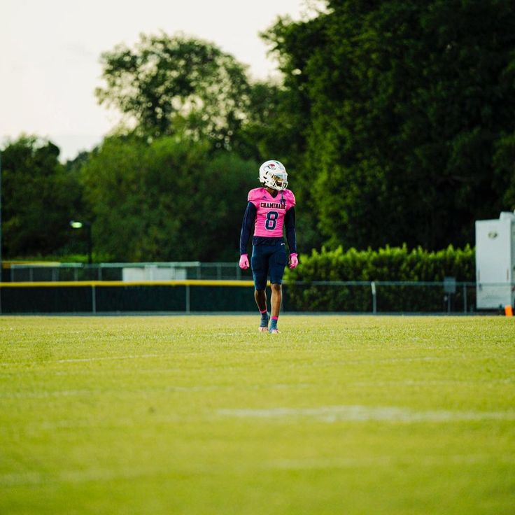 a football player is walking across the field