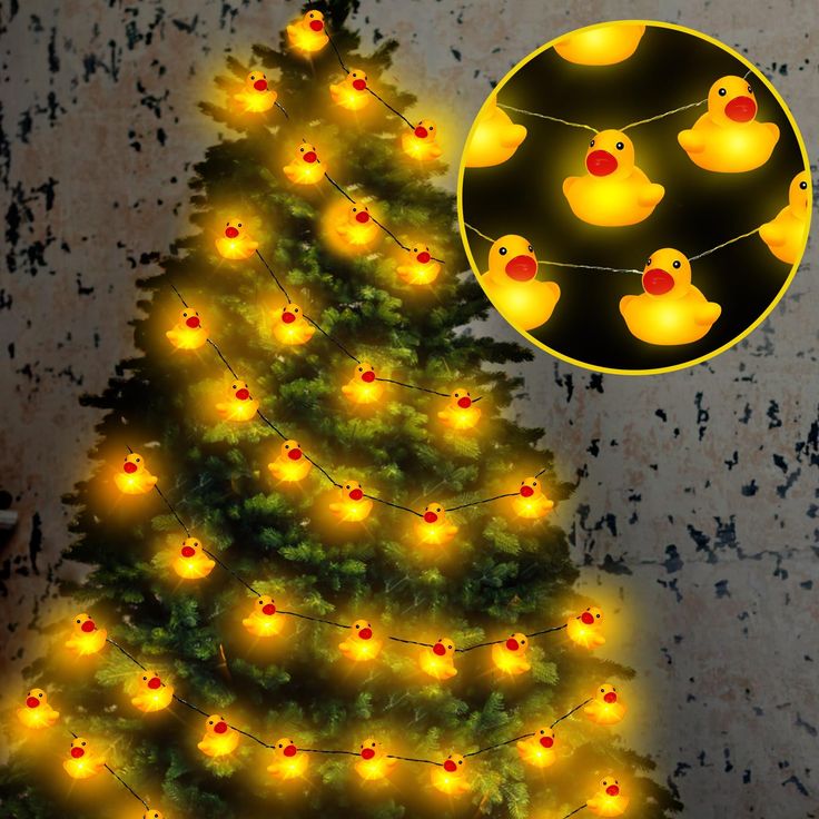 a lighted christmas tree with rubber ducky ducks on it's lights and an image of a rubber duck in the background